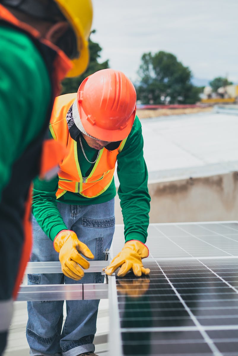 Solar Technician Installing Solar Panel